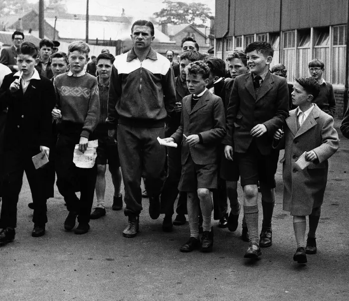 Framed Print : Ferenc Puskas Real Madrid footballer is mobbed by schoolchildren after leaving training Framed Print : Ferenc Puskas Real Madrid footballer is mobbed by schoolchildren after leaving training
