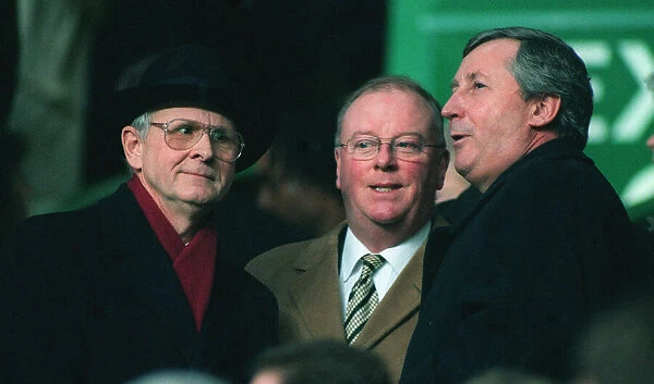Fergus McCann at Celtic v Rangers game with friends 1998 black hat coat