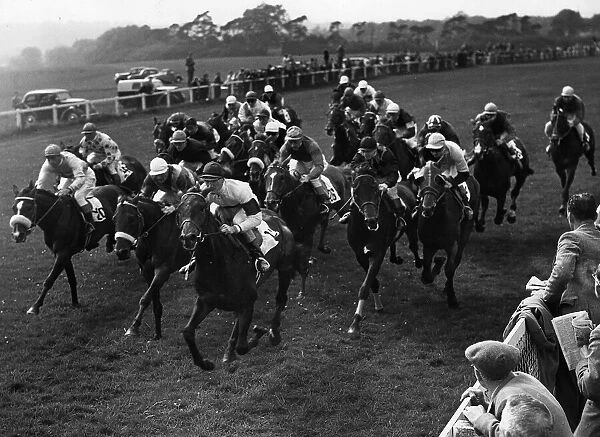 The field in The Derby passing the mile post, Phil Drake the eventual Derby Winner at
