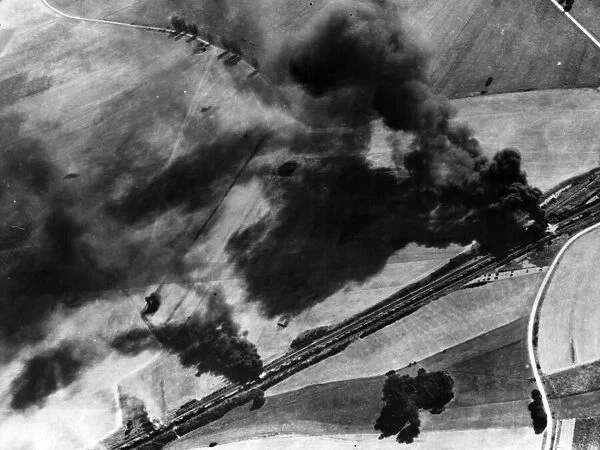 Fighters of the US 8th Air Force attack rail yards at Guise