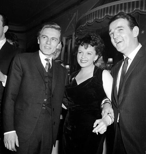 Film actress Judy Garland with pop singer Adam Faith (left