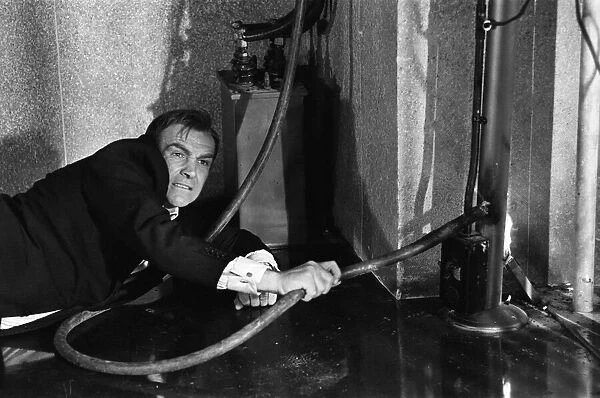 Film Goldfinger 1964 Sean Connery as James Bond 007 electrocutes Goldfinger