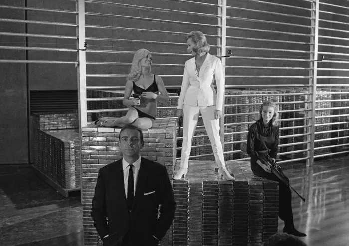 Framed Print : Film Goldfinger 1964 Sean Connery as James Bond 007 poses with Bond girls Honor Blackman