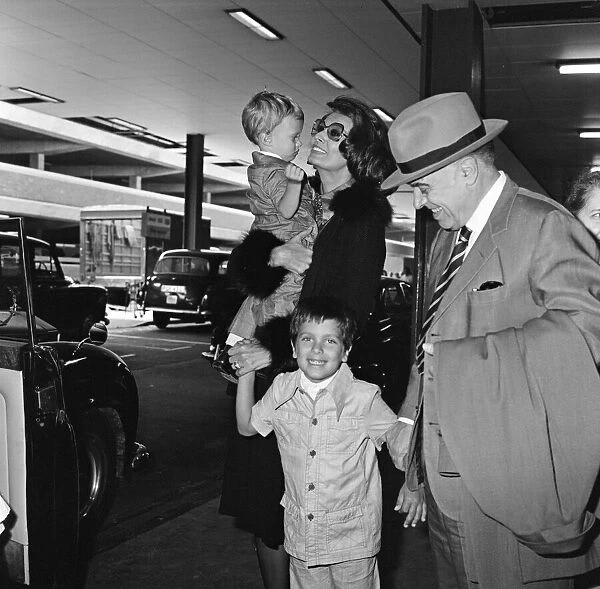 Film producer Carlo Ponti arrives in London with his two sons Edward