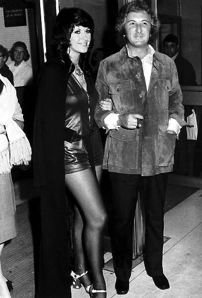 Film Producer Michael Winnner is accompanied by model Valli Kemp at a Film Premiere of