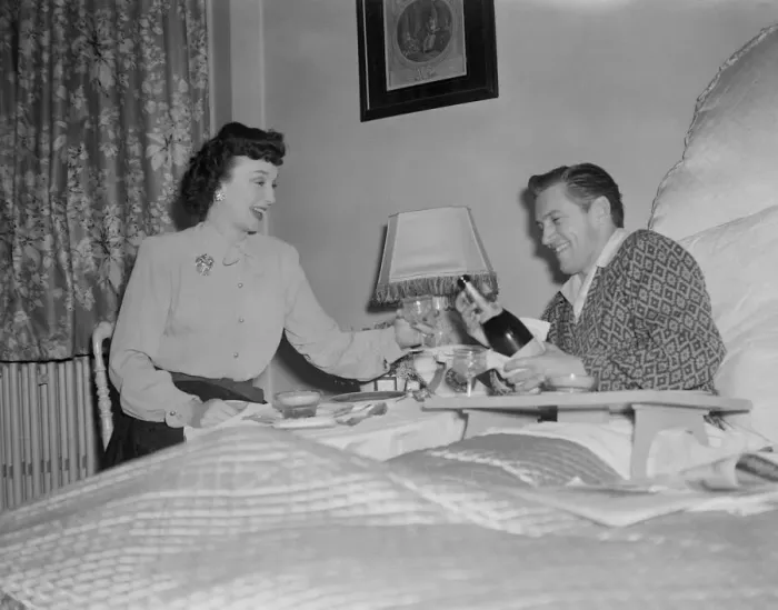 Framed Print : Film stars celebrate 1st Wedding Anniversary. 1949 John McCallum in bed with Framed Print : Film stars celebrate 1st Wedding Anniversary. 1949 John McCallum in bed with