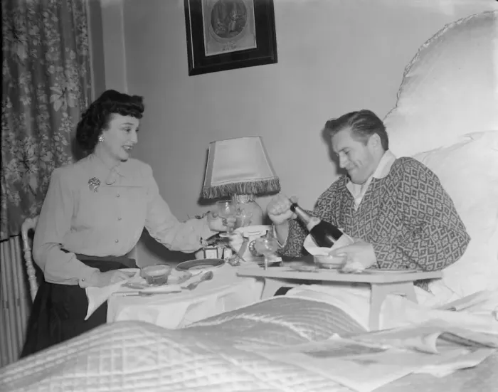 Framed Print : Film stars celebrate 1st Wedding Anniversary. 1949 John McCallum in bed with