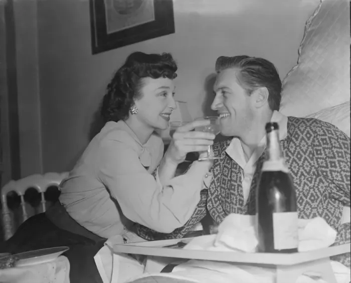 Framed Print : Film stars celebrate 1st Wedding Anniversary. 1949 John McCallum in bed with