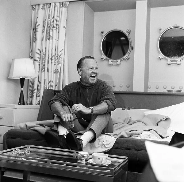 Film and TV star Mickey Rooney in his cabin of the U. S.s United States at Le Havre