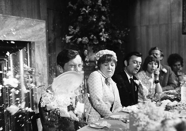 Filming Carry on Loving at Pinewood Studios. Kenneth Williams sitting
