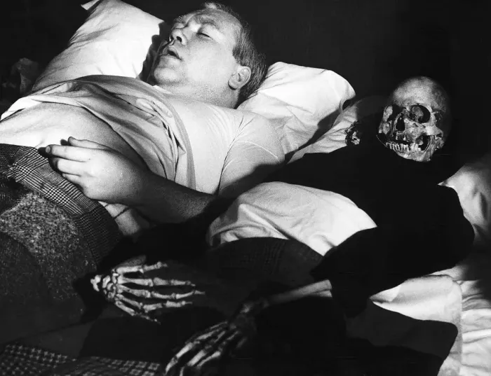 Framed Print : Films Under Milk Wood starring in a scene is actor Ray Smith with his skeleton wife in Framed Print : Films Under Milk Wood starring in a scene is actor Ray Smith with his skeleton wife in