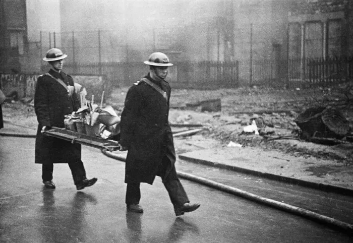 Framed Print : Fire crews, police and Air Raid Precaution (ARP) wardens help salvage furniture