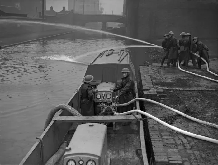 Framed Print : Fire Float Practice. Members of the Birmingham Auxiliary Fire Service Naval Detachment