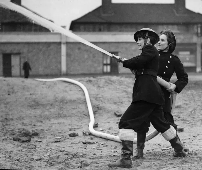 Framed Print : Fire women of the National Fire Service using a hose during training exercises inn Framed Print : Fire women of the National Fire Service using a hose during training exercises inn