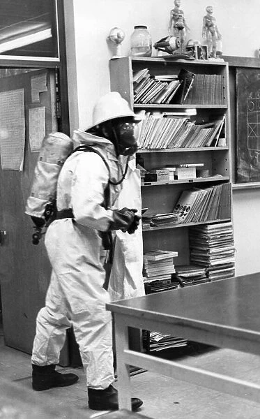 A firefighter checks the classroom is safe
