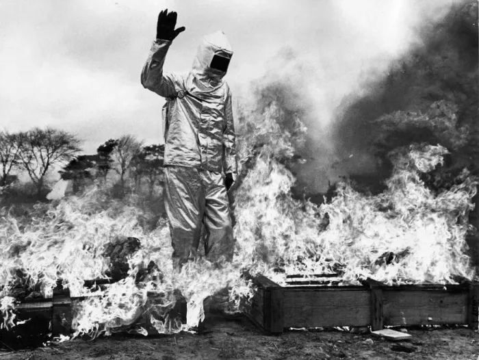 Framed Print : Firefighter Dave Katz walks throught a tunnel of fire to demonstate the fireproof suit Framed Print : Firefighter Dave Katz walks throught a tunnel of fire to demonstate the fireproof suit
