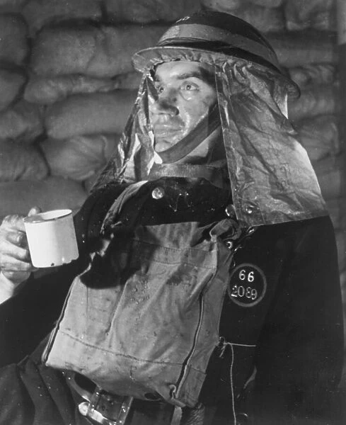 A firefighter takes a well earned break for a cup of tea after attending to many bombed