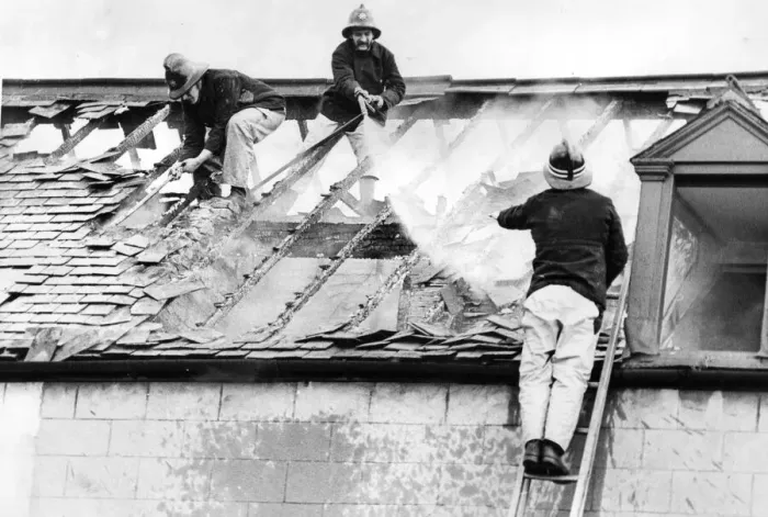 Framed Print : Firefighters clambered over the roofs high above Stockton yesterday to tackle a blaze