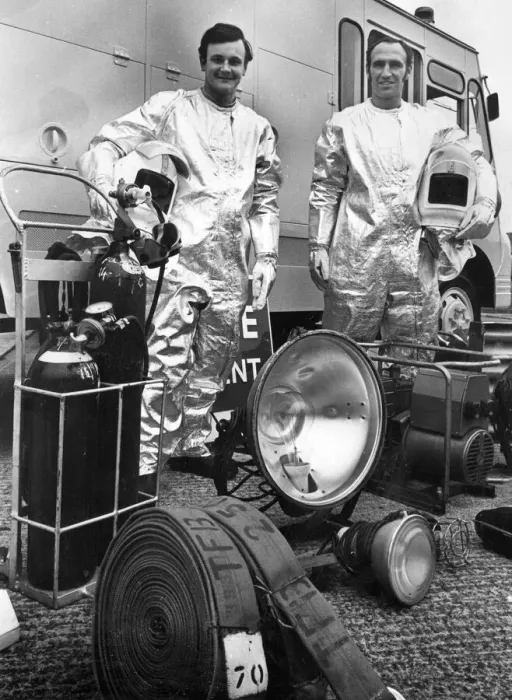 Framed Print : Firefighters David Edwards, left, and Ken Bailey dressed in heat proof suits with