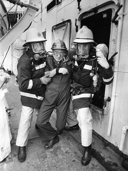 Firefighters taking part in a training exercise aboard former destroyer HMS Cavalier