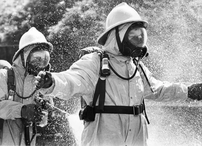 Framed Print : Firefighters wearing protective suits fought a blaze in an asbestos unit at Poter Limited Framed Print : Firefighters wearing protective suits fought a blaze in an asbestos unit at Poter Limited