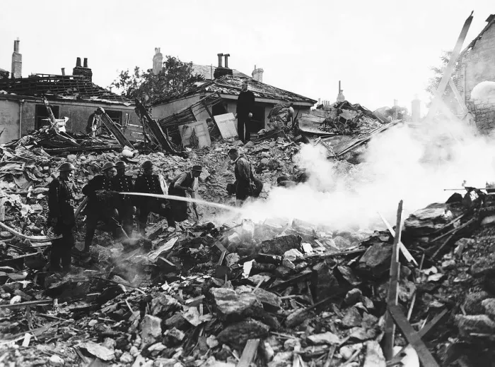 Framed Print : Firemen damp down a fire at a Southampton building after WW2 air raid. 1943 Framed Print : Firemen damp down a fire at a Southampton building after WW2 air raid. 1943