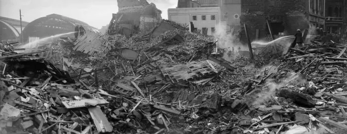 Framed Print : Firemen dampen down the shattered remains of John Bright Street, Birmingham