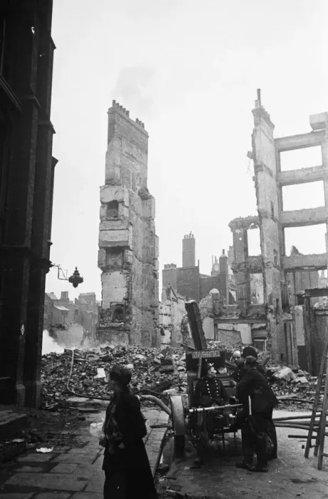Framed Print : Firemen dampening down the smouldering ruins in the the City of London following
