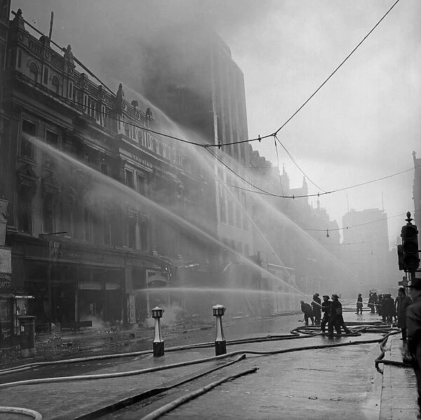 Firemen fight a fire at Marshall & Snellgroves department store, New Street, Birmingham