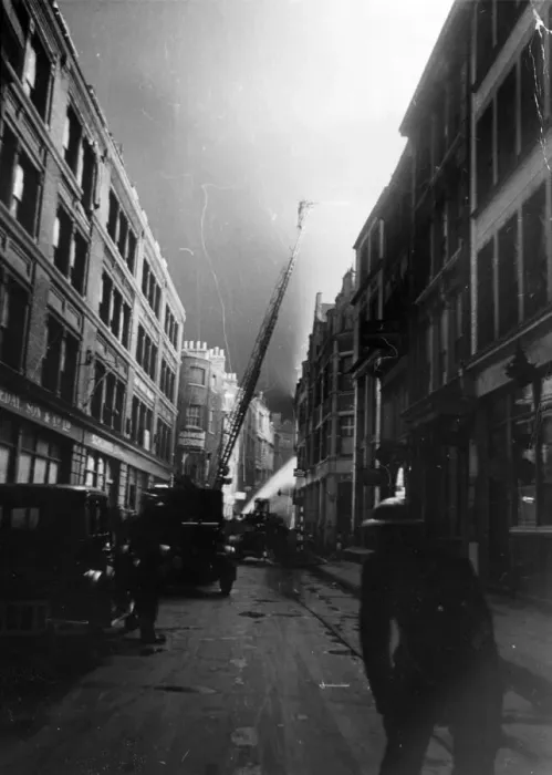 Framed Print : Firemen in the London area on top of their job. They soon quelled this fire