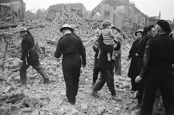 Firemen rescue young children after daylight raid, Circa 1940