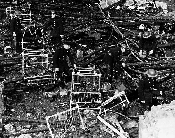 Firemen search the remains of a London hospital 1944 after an air raid by German