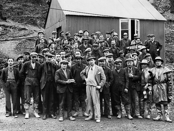 The first bar of gold at Dolaucothi Gold Mine with day shift workers