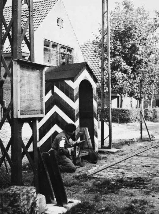 Framed Print : First British troops to enter Germany. A Sherwood ranger crouches by the side of Framed Print : First British troops to enter Germany. A Sherwood ranger crouches by the side of