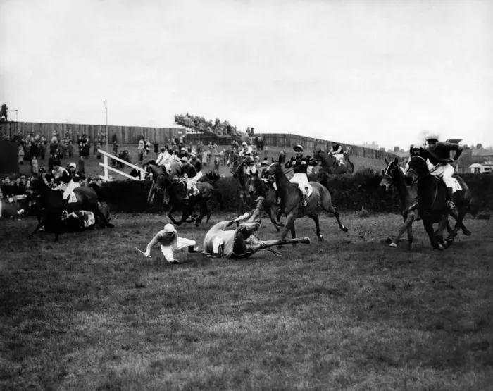 Framed Print : At the first fence in the 1953 Grand National Tim Moloney (white breeches