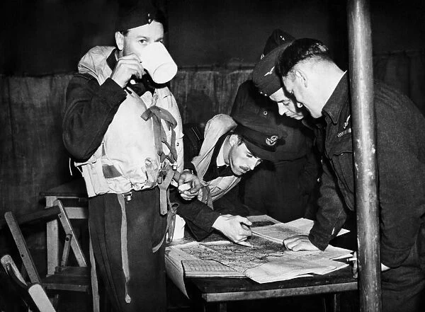 The first of many interrogating a night pilot and navigator returning from D-Day