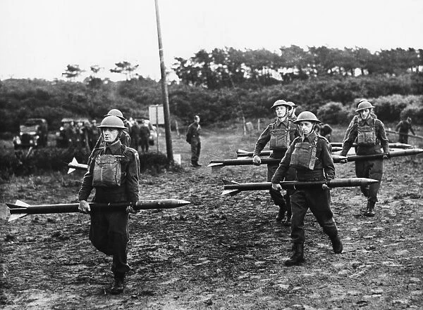 First pictures of the Home Guard A. A in action Carrying the rockets to the projectors