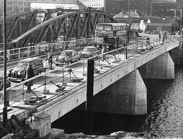 The first traffic moves across the new bridge over the River Tawe at Swansea on Monday