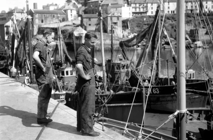 Framed Print : Fisherman on the quayside look longing at the boats of Fishing fleet at Brixham, Devon Framed Print : Fisherman on the quayside look longing at the boats of Fishing fleet at Brixham, Devon