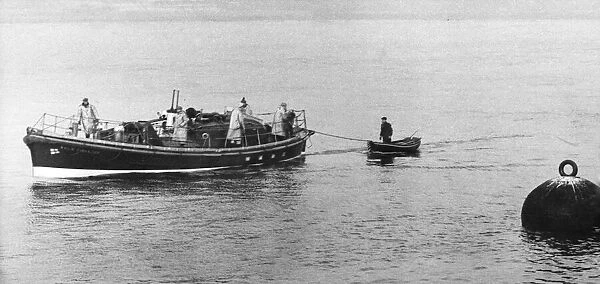 A fisherman is towed to safety by the Tynemouth lifeboat