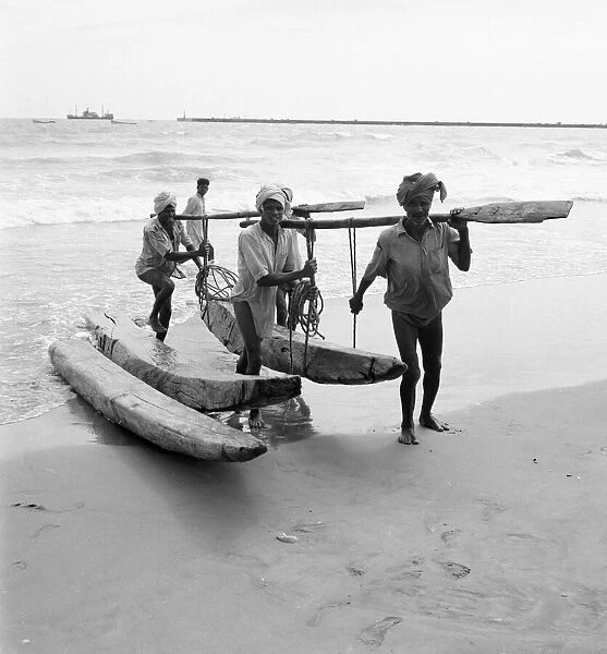 Fishermen and beachcombers gather on Chowpatty beach Bombay. February 1961