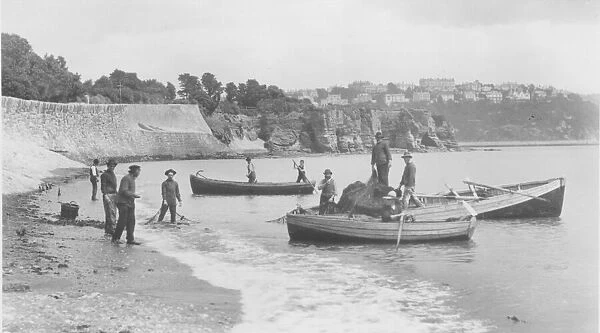 Fishermen launching their seine nets off Livermead beach in 1888