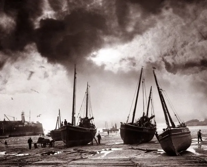 Framed Print : Fishermen off-load nets for repair and carry out essential maintenance to their boats Framed Print : Fishermen off-load nets for repair and carry out essential maintenance to their boats