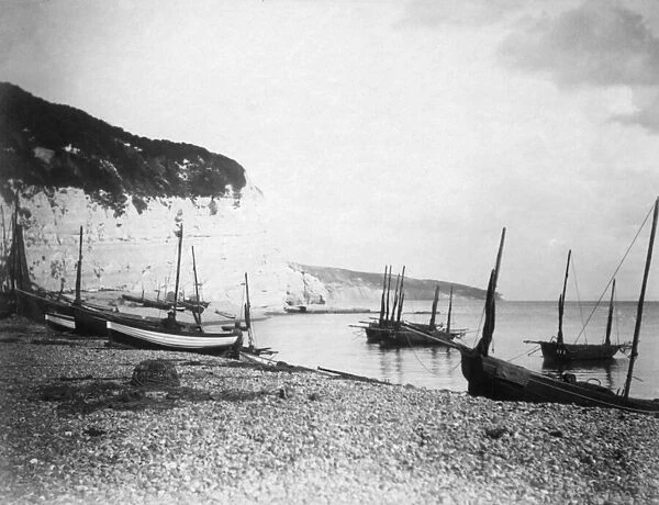 Fishing boats on the beach at Beer, Devon. Circa 1895