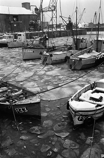 Fishing boats frozen in Whitstable Harbour, Kent. 20th January 1966