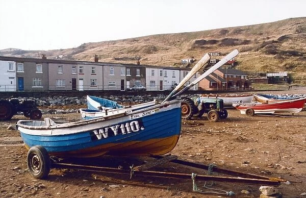 Fishing cobles are drawn up on the sea shore at Skinningrove where once boats arrived to