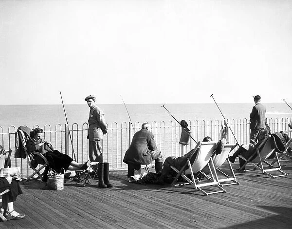 Fishing from Hastings Pier, East Sussex. 6th October 1952