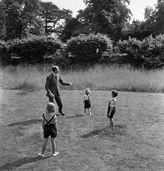 Fitzroy Maclean playing with his children, Jeremy, Susan