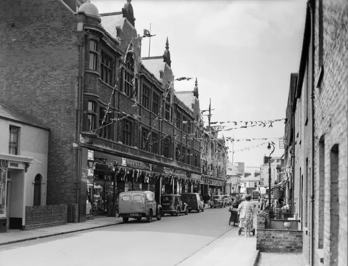 Framed Print : Flags fluttering in the breeze, decorations in traditional colours lining the streets