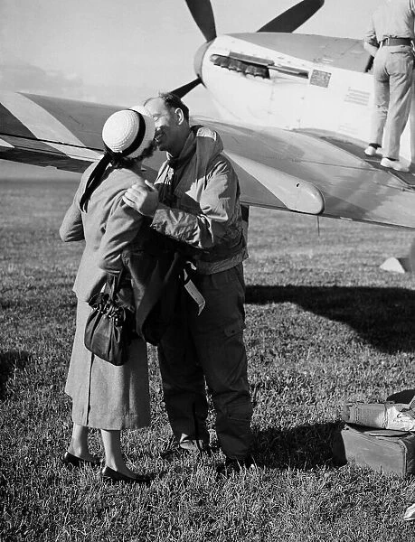 Fleet Air Arm Pilots return from Korean War - A pilot is greeted by his wife with a kiss